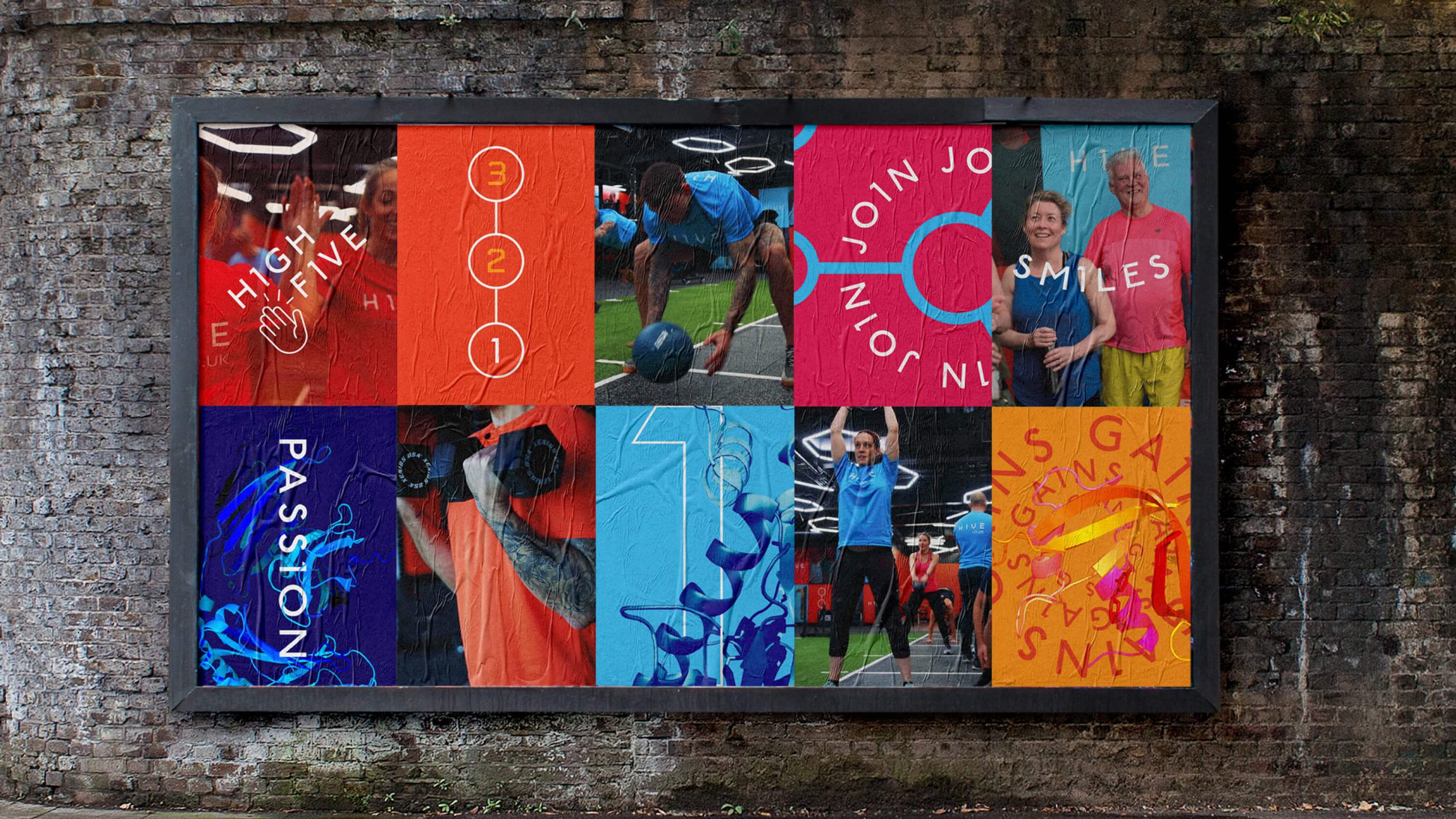 colourful promotional posters on a brick wall